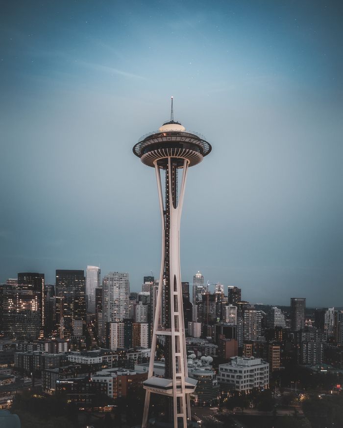 A stunning view of Seattle's skyline featuring the Space Needle at twilight, showcasing urban architecture.