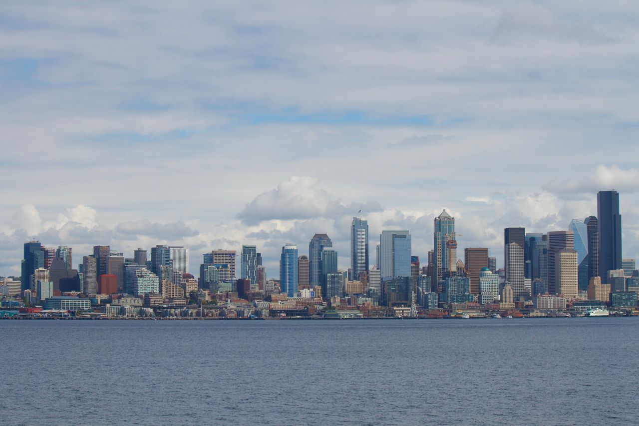 Scenic view of Seattle's iconic skyline with prominent skyscrapers and waterfront.